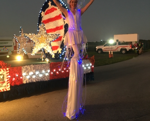 Stilt Lady and military float